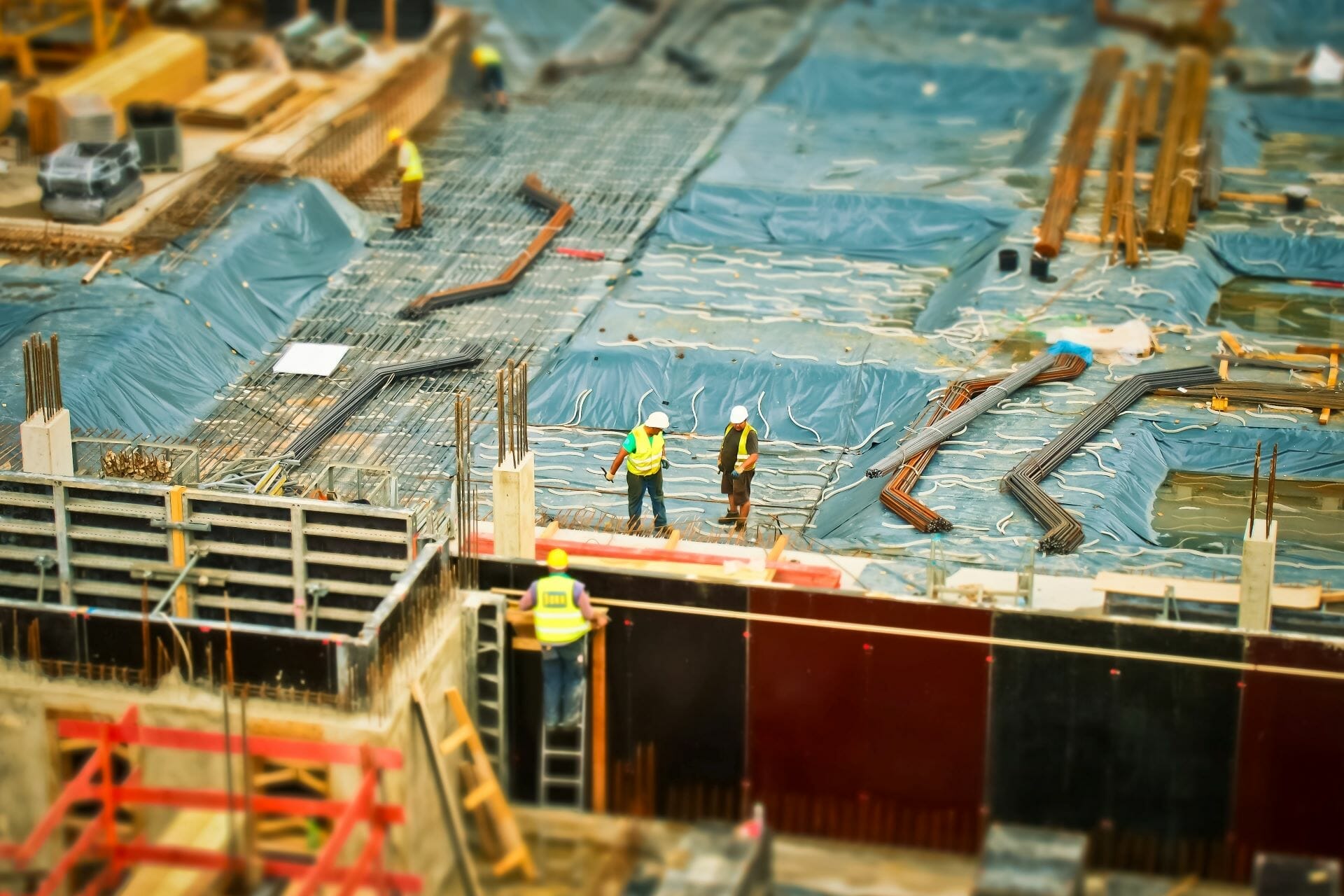 Men working on a building project to represent the need for permits and licenses when working on projects in Washington, D.C.