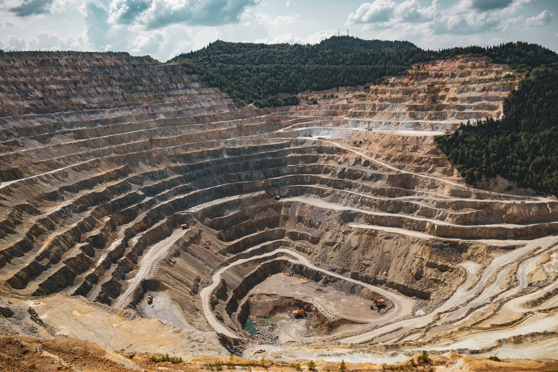 Large pit of former mine showing tremendous erosion and sediment displacement.