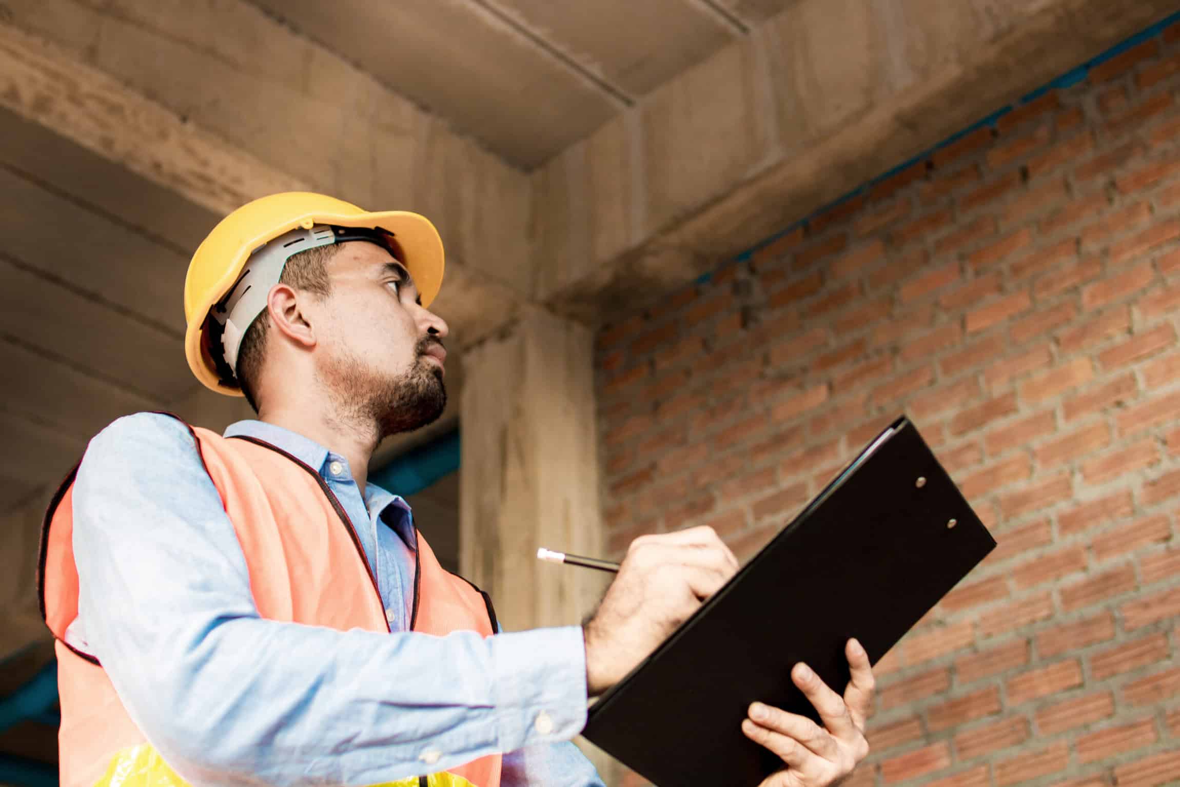 Engineer or inspector checking progressing work in construction