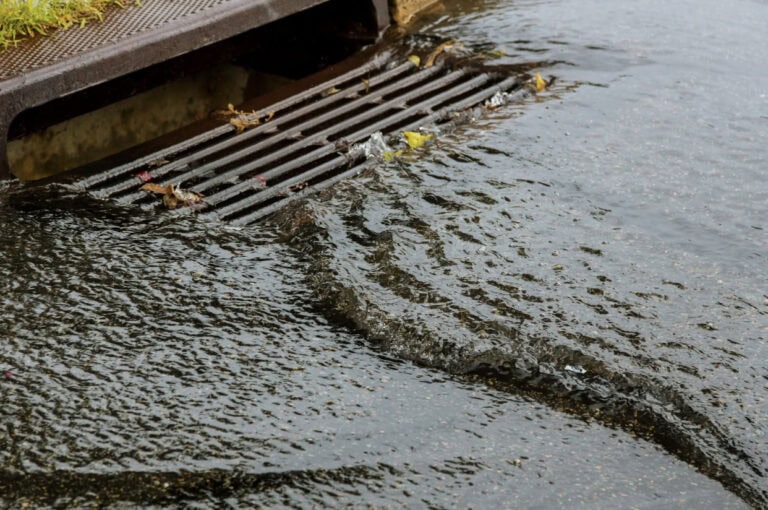 water rushing into storm drain
