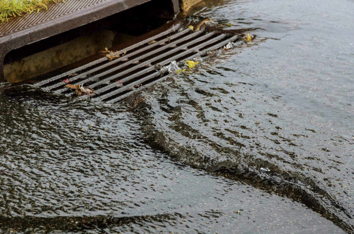 water rushing into storm drain